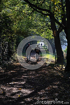 Ramblers Enjoying a Rural Walk on a Sunny Autumn Morning. Editorial Stock Photo