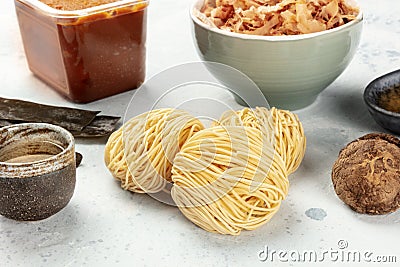 Ramen ingredients. Dried sea vegetable kelp, soba noodles, dashi, tuna flakes, shiitake mushrooms etc Stock Photo