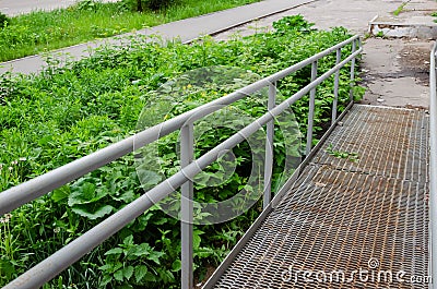 Ramp way with stainless steel handrail for support wheelchair disabled people Stock Photo