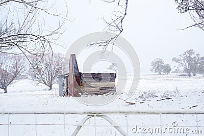 Ramshackle rustic shack in snowy rural scene Stock Photo