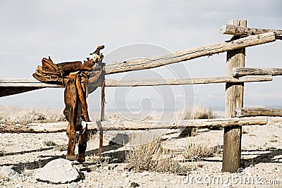 Ranch - saddle on fence Stock Photo