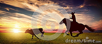 Rancher lassoing a runaway cow Stock Photo