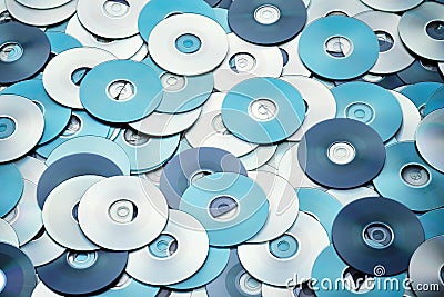 Random arrangement of silver blue grey DVD and CD data storage disks Stock Photo