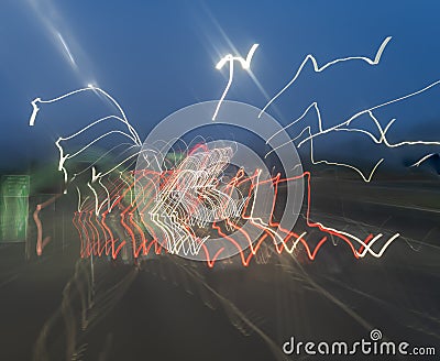 Random patterns of light-streams from moving vehicles Stock Photo