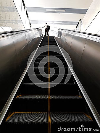 A random person walking on the escalator in AG-DMS Chennai, Tamil Nadu Editorial Stock Photo