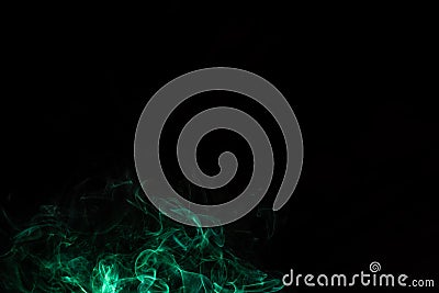 random shapes of colored smoke fired with colored flash green Stock Photo