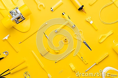 Top view of random yellow objects in order on yellow background Stock Photo