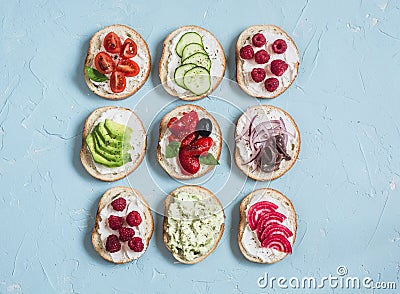 Range of sandwiches - sandwiches with cheese, tomatoes, anchovies, roasted peppers, raspberries, avocado, bean pate, cucumber Stock Photo