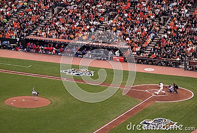 Rangers Pitcher CJ Wilson throws ball to Giants batter Pat Burrell as he swings at incoming pitch Editorial Stock Photo