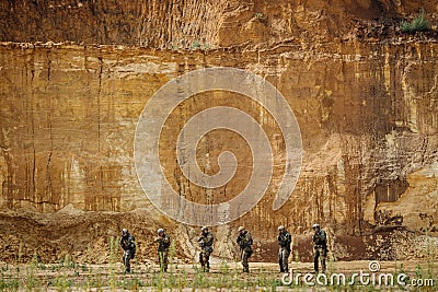 Rangers team standing with rifle and looking at camera Stock Photo