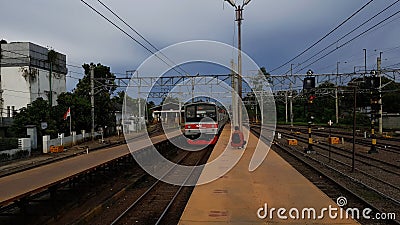 Rangkas Bitung, Indonesia - March 13 2021:An Indonesian man waiting a commuter train arrived at Rangkasbitung Station Editorial Stock Photo