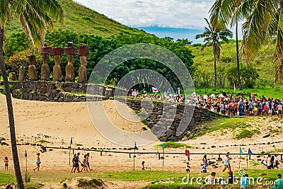 Rapa Nui historic boat arrives to Anakena beach, the crowd reception in Ahu Nau Nau Editorial Stock Photo