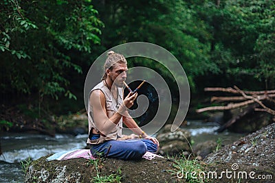 Rape Ceremony and meditation in nature. Shamanic tradition Stock Photo