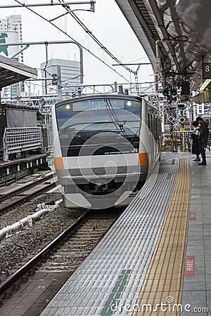 Rapid commuter train arrives Shinjuku station Tokyo Editorial Stock Photo