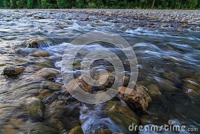 Rapid flow of a mountain river, clear water Stock Photo