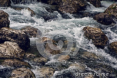 Rapid stream with rocks and moss Stock Photo