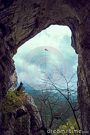 Rappeling in a cave. Stock Photo