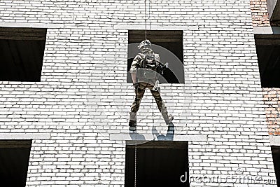 Rappeling with weapons Stock Photo