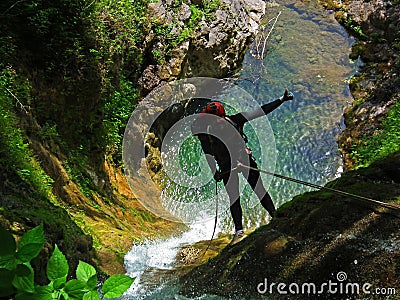 Rappelling on forest waterfall Editorial Stock Photo