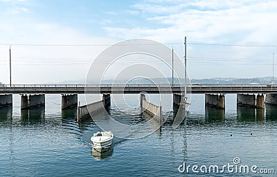 Rapperswil, SG / Switzerland - November 5, 2018: motorboat with female captain passes from the lower to the upper Lake Zurich thr Editorial Stock Photo