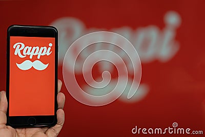 Rappi logo on the phone with the logo at the bottom, Rappi App Editorial Stock Photo