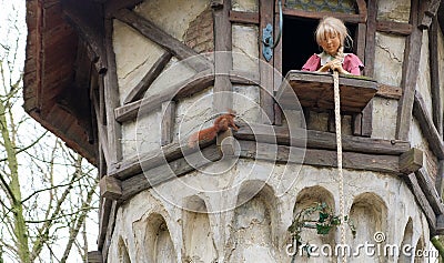 Rapunzel is waiting for her lover in a high tower. Instead a squirrel came. Attraction in theme park efteling Editorial Stock Photo