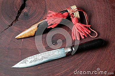 rare vintage retro knife with wooden knife collar or cover. speacial metal with graphic chisel carve on the sharp. Stock Photo