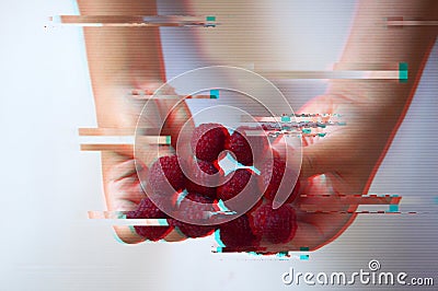 Raspberries on the fingers of a child, glitch effect Stock Photo