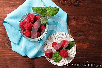 Raspberries in a glass container and on a string circle Stock Photo