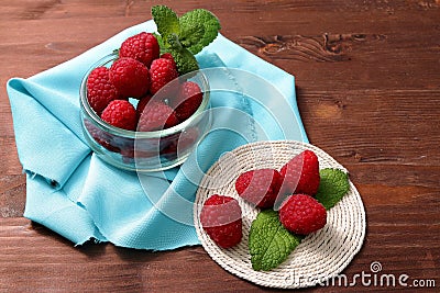 Raspberries in a glass container and on a string circle Stock Photo