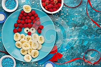 Raspberry banana chocolate santa - healthy festive food Stock Photo