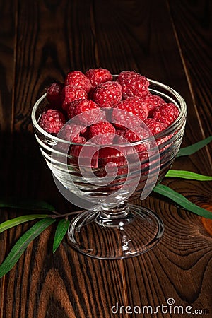Raspberry bowl on wood Stock Photo
