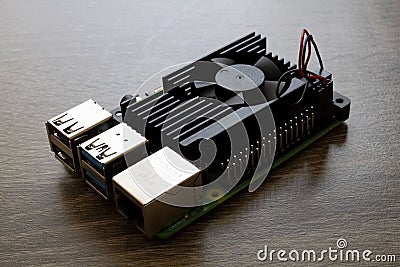 Raspberry Pi Microcomputer 4B with a black heatsink for Electrical Engineering prototyping Editorial Stock Photo