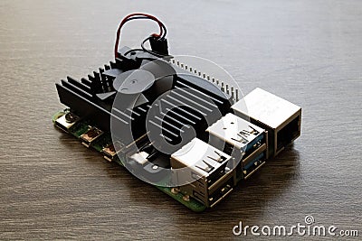 Raspberry Pi Microcomputer 4B with a black heatsink for Electrical Engineering prototyping Editorial Stock Photo