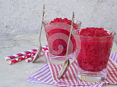 Raspberry sorbet in glasses. Frozen berry dessert on light background. Pink ice cream. Space for text. Stock Photo