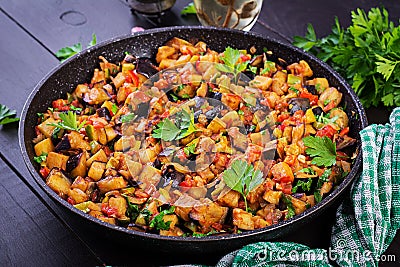 Ratatouille. Vegetarian stew eggplants, bell peppers, onions, garlic and tomatoes with herbs. Stock Photo