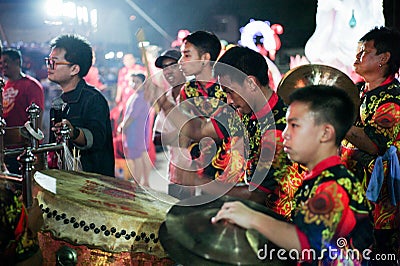 Ratchaburi, Thailand:January 24,2020 - Selective focus on portrait of male drummer performs with traditional band in Chinese new Editorial Stock Photo