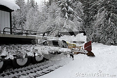 Ratrac. Ratrack, snow grooming machine prepares slopes for skiers on a ski resort in mountains. Ratrac machine for skiing slope pr Stock Photo
