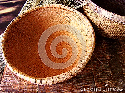 Rattan basket and fishing net Stock Photo