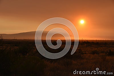 Rattlesnake Mountain Ghost World: Forest Fires Fuel Sunset Skies Stock Photo