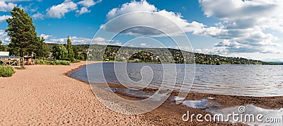 Rattvik, Dalarna - Sweden - Group of young people at a camping on the sandy beach of the Siljan lake Editorial Stock Photo