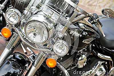 Ratzeburg, Germany, July 31, 2022: Part of a Harley Davidson motorcycle from the front with headlights, orange lamps and chrome, Editorial Stock Photo