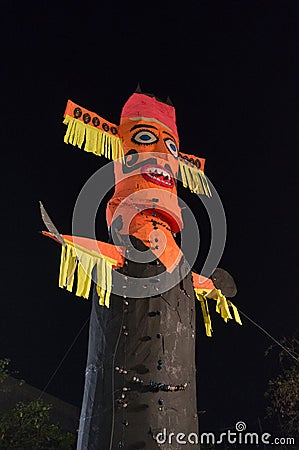 Ravan Ravana effigy standing against night sky on dussera Stock Photo