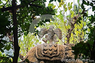 Raven sculpture over an elephant made by trunks and designed by Salvador DalÃ­. Ancient family crest in Gala Castle Editorial Stock Photo