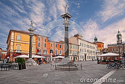 Ravenna, Emilia-Romagna, Italy: the main square Piazza del Popolo with the ancient columns with the statues of Saint Apollinare Stock Photo