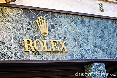 light is enlightening ROLEX logo on storefront Editorial Stock Photo