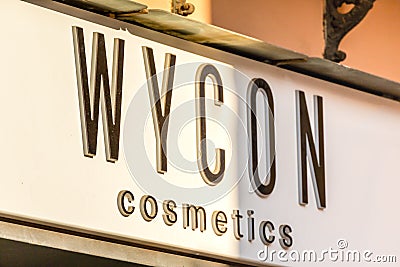 light is enlightening WYCON COSMETICS logo on storefront Editorial Stock Photo