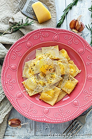 Ravioli with egg yolk, black pepper and parmesan. Stock Photo