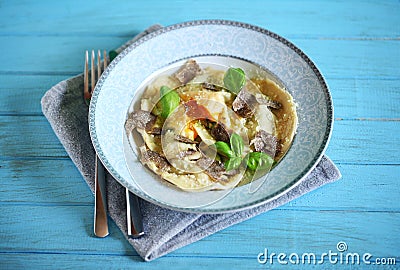 Ravioli with egg yolk and ricotta, with shaved black truffle Stock Photo