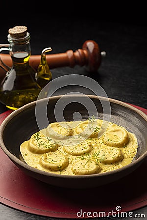 Ravioli pasta egg yolk raviolo stuffed with sauce gravy Stock Photo